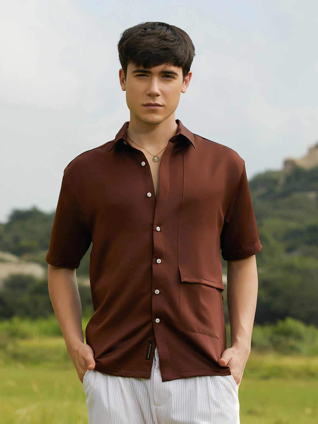 ₹999 | Campus Sutra mens Chocolate Brown Solid Flap Oversized