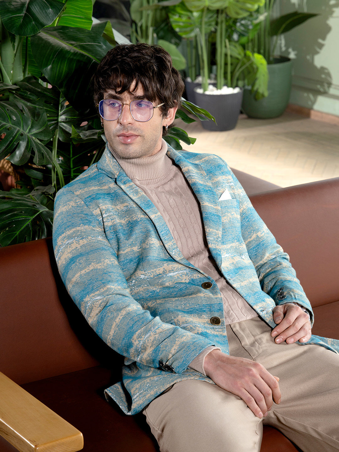 sky blue tailored blazer with an abstract gradient-stroke jacquard pattern.