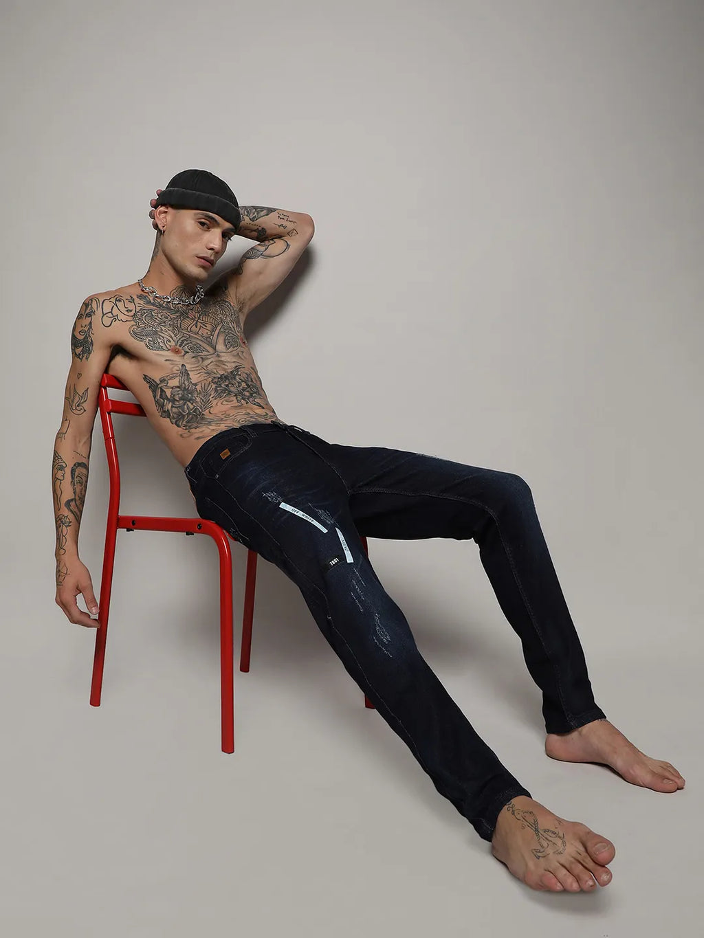 Distressed Denim Jeans With Embroidered Details